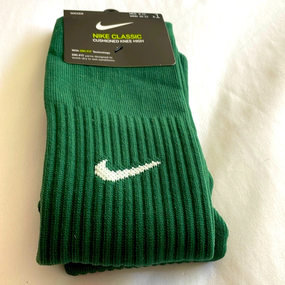 Nike classic cushioned knee high soccer socks. Green in new condition. NWT